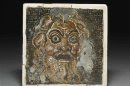 A comic mask mosaic, one of the exhibits in "Life and death in Pompeii and Herculaneum", is seen in this handout photograph provided by the British Museum in London