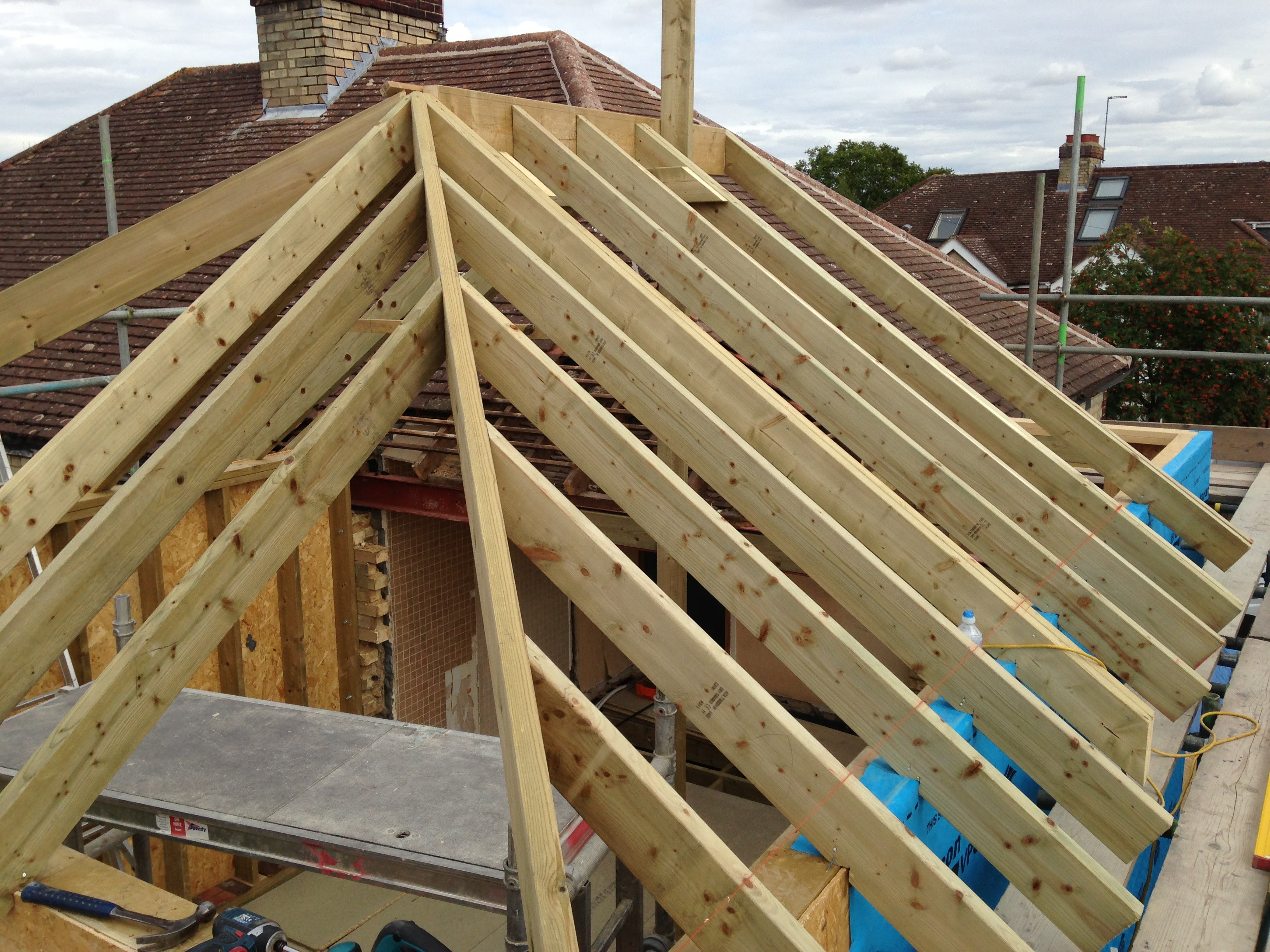 how-to-build-hip-roof-with-valley-for-new-home-addition-when-attaching