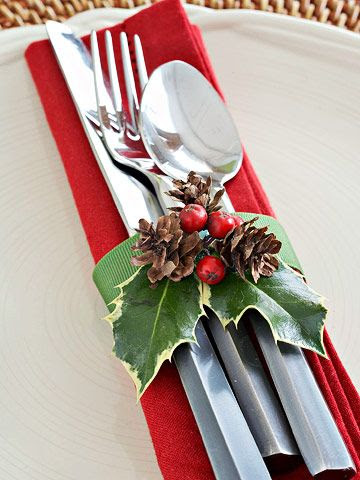 Cranberry and Holly Silverware Wrap ~ A simple loop of green grosgrain ribbon decorated with a berried holly sprig hugs silverware and a Christmas-red napkin.