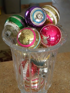 Vase full of vintage striped ornaments