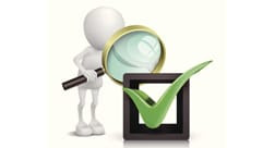 figure looking through magnifying glass at a checkmark