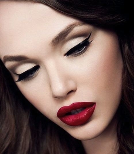 Bold lipstick and cat eyes.