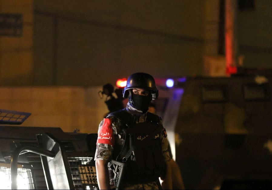 A policeman is seen near the Israeli embassy in Amman, Jordan July 23, 2017.