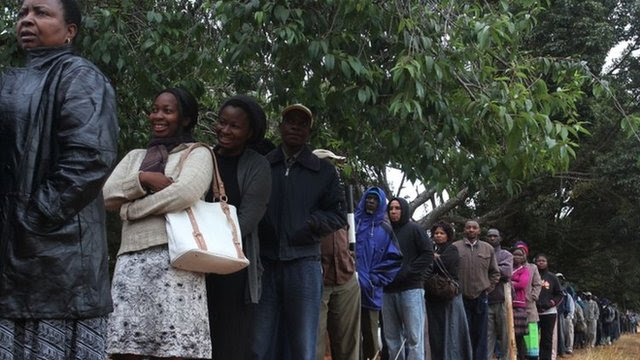 A queue of voters wait to cast their ballots as the country went to the polls in a Harare suburb Wednesday 31 July 2013