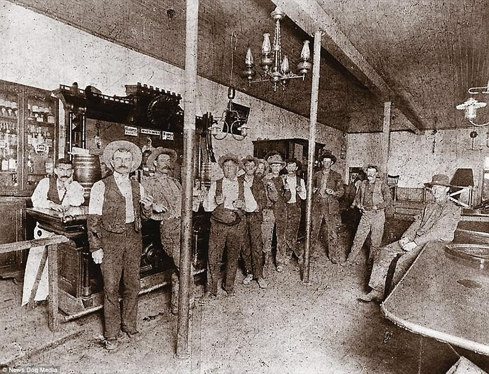 Members of the notorious Hash Knife Cowboys pose for a picture at the Fashion Saloon in Winslow, north eastern Arizona.  The cowboys were initially hired to help the Aztec Land & Cattle Company look after the more than 33,000 cattle they had acquired. However, the outfit soon gained an unsavory reputation