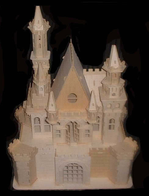 CDHM Artisan Tracy Topps of Minis On The Edge creates paper clay dollhouses in 1:12, 1:24, 1:48 and even 144 scale dollhouse kits.  Finishing the dollhouses in the style of the old european castles, and victorian styles of england, you america