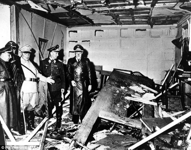 After the bomb: The aftermath of the assassination attempt at Wolf's Lair. Hermann Goering, pictured in a light uniform, inspects the wrecked room