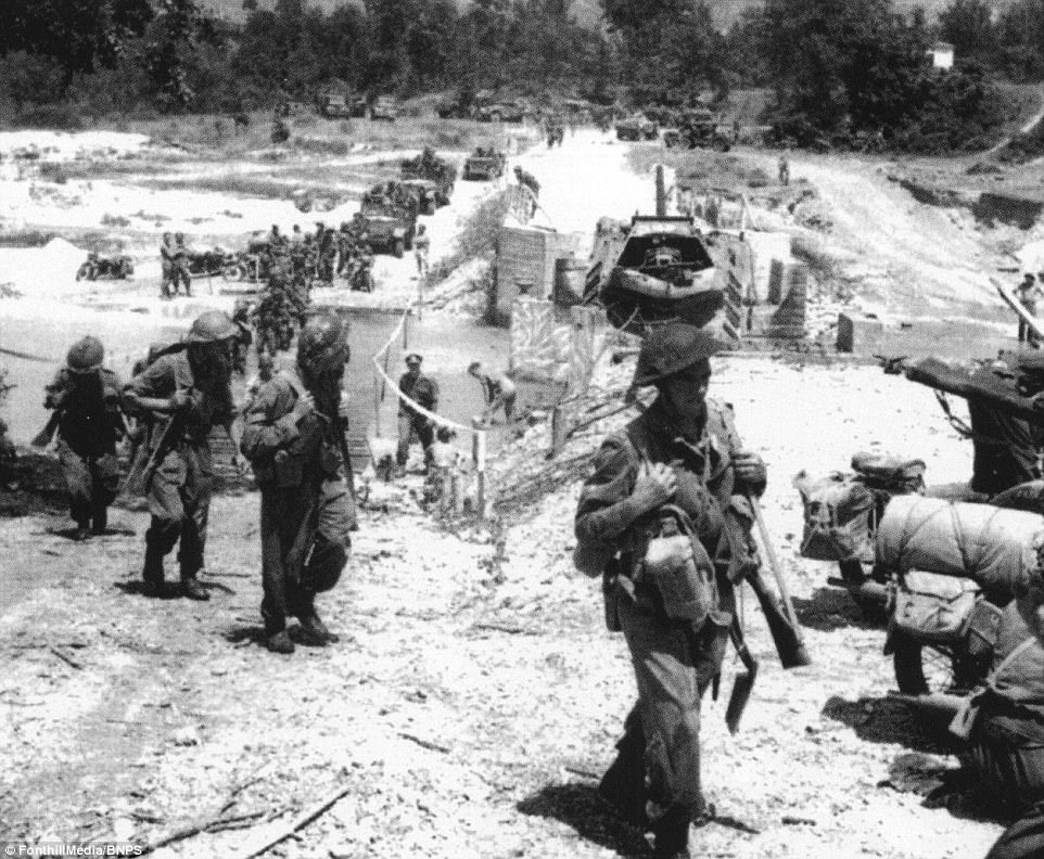 These harrowing images of Monte Cassino feature in a new book about the military offensive which sheds fresh light on atrocities committed by French forces after the famous battle. Pictured above, after the fall of the Gustav Line, British tanks of the 78th Infantry Division cross a pontoon bridge in Liri valley