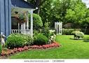 Picture of a Landscaped Front Yard of a House with Flowers, Plants ...