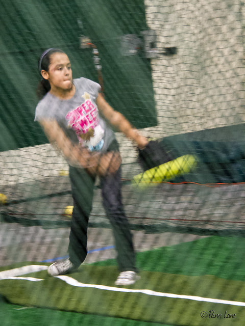 Triple Play batting cages - girl pitching