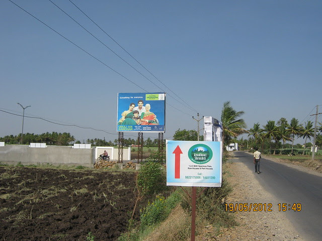 Site Hoarding on the Road to Uruli Kanchan Railway Station - Visit Kanchan Vrundavan, 1 BHK & 2 BHK Flats at Koregaon Mul, near Uruli Kanchan Pune 412202