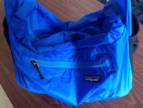 Patagonia Lightweight Travel Courier with camera supported by strap
