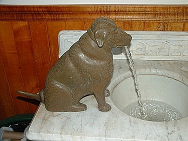 bathroom faucet and sink inside the gallery/shop