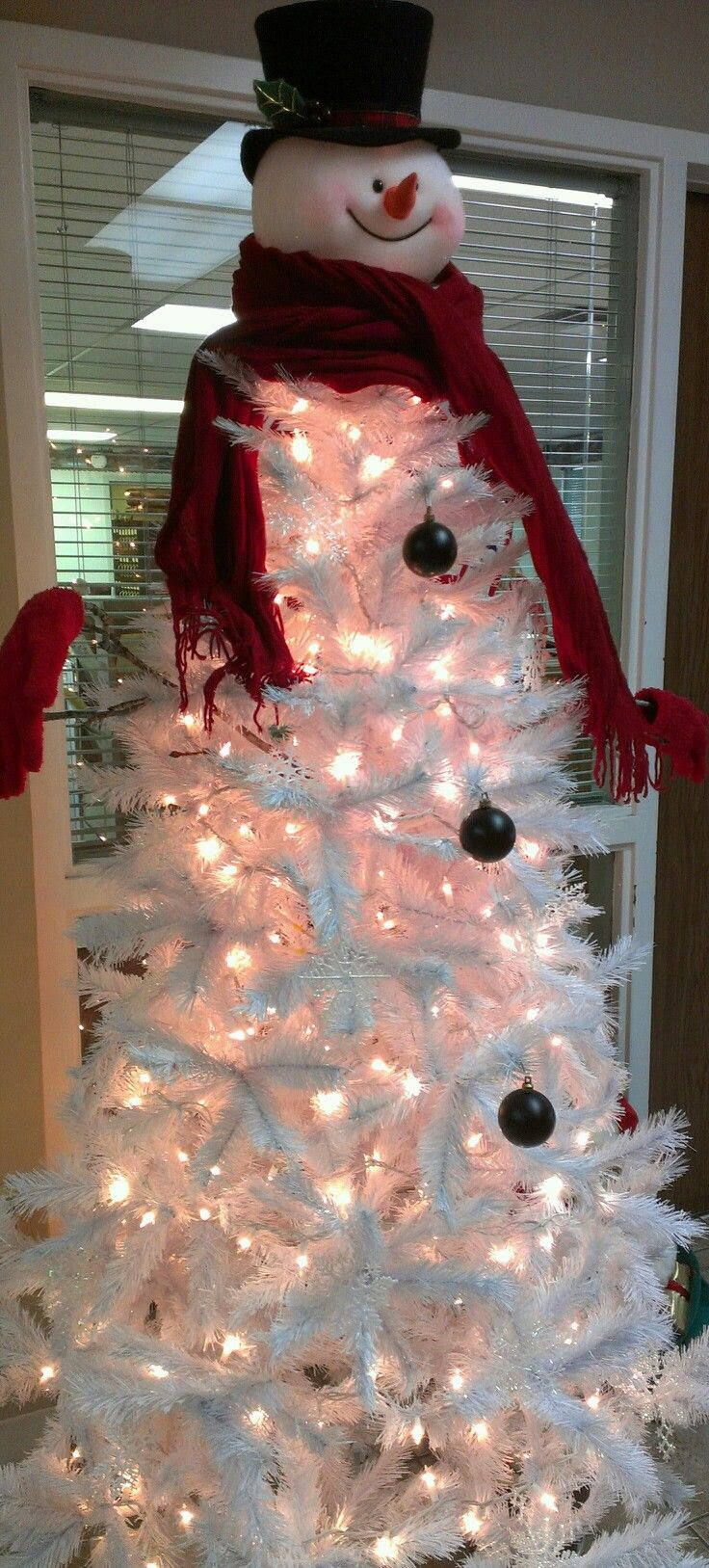 Even though I don't like white trees, this would look so cute as a classroom tree. Such a creative Christmas tree idea!  (love topper - unique to sell white tree)