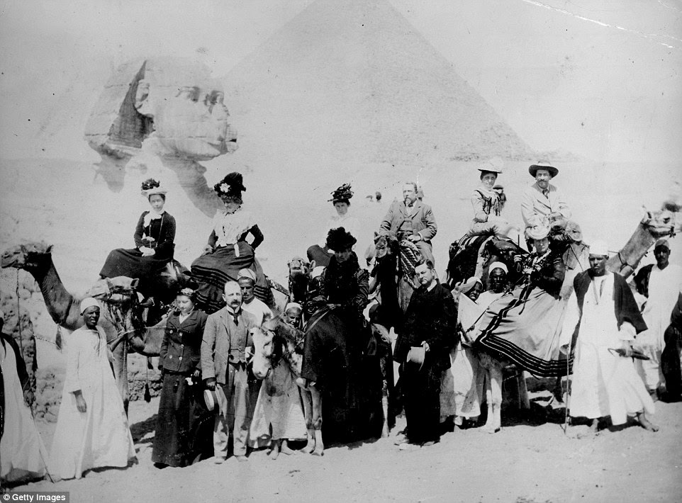 British tourists pose in front of the Sphinx in Giza, Egypt in fashionable clothing from the 1880s