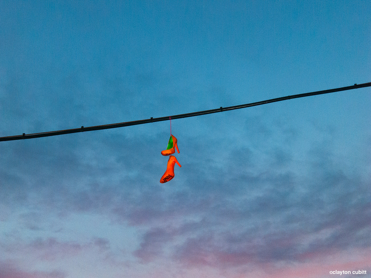 http://claytoncubitt.tumblr.com/post/29652157224 Heels over power line at sunset (1153)