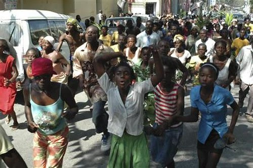 Haitians protest the lack of direct aid to the people of the Caribbean nation. An earthquake struck the country on Jan. 12, yet most people have not received the assistance they need. by Pan-African News Wire File Photos
