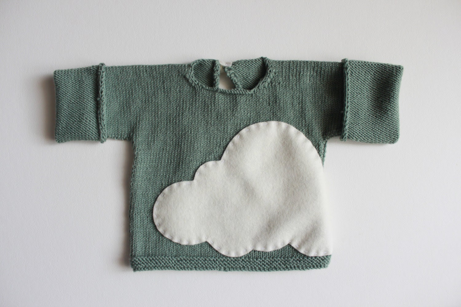 Handknitted baby sweater in 100% baby merino in green mint, with a lovely cloud. Special newborn gift