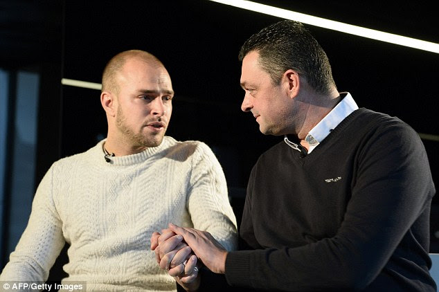 Comfort: Also appearing at a press conference were Christophe Boisseau (right), whose caretaker brother Frederic Boisseau was shot dead in the attack, and colleague Jeremy Ganz (left) who was with him at the time
