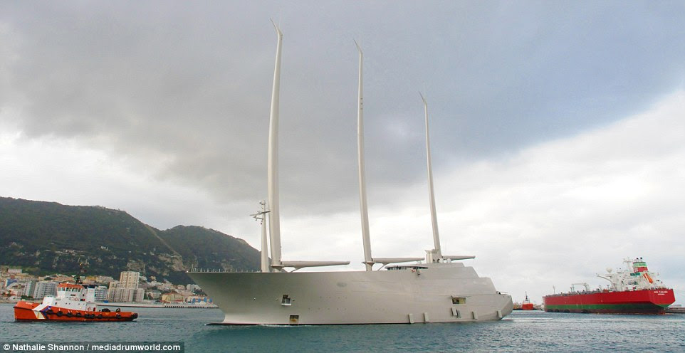 A tanker in the background is absolutely dwarfed by the huge Sailing Yacht A which bobs in the water in Gibraltar