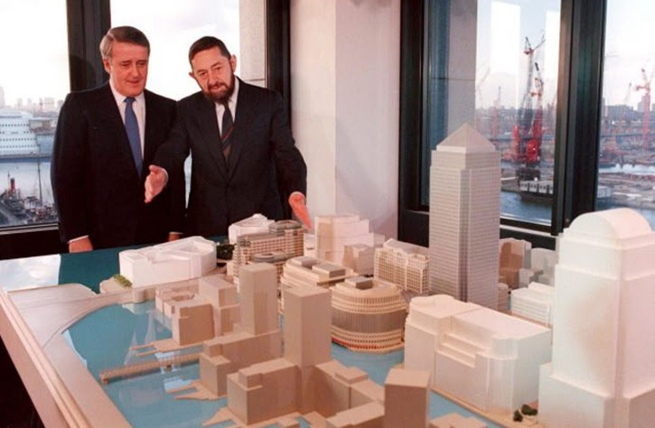 AP FILE - Then Canadian prime minister Brian Mulroney, left, and Paul Reichmann, who died Friday, look at a model of the proposed Canary Wharf in London.