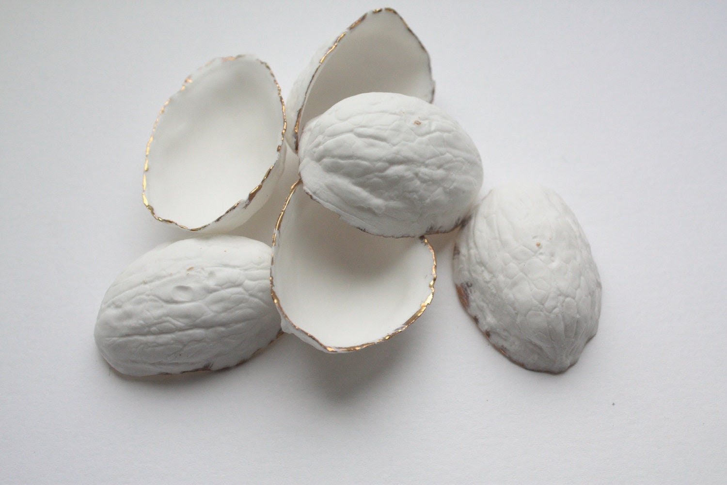 Walnut shells from stoneware English fine bone china and real gold, stoneware porcelain, white ceramic - madebymanos