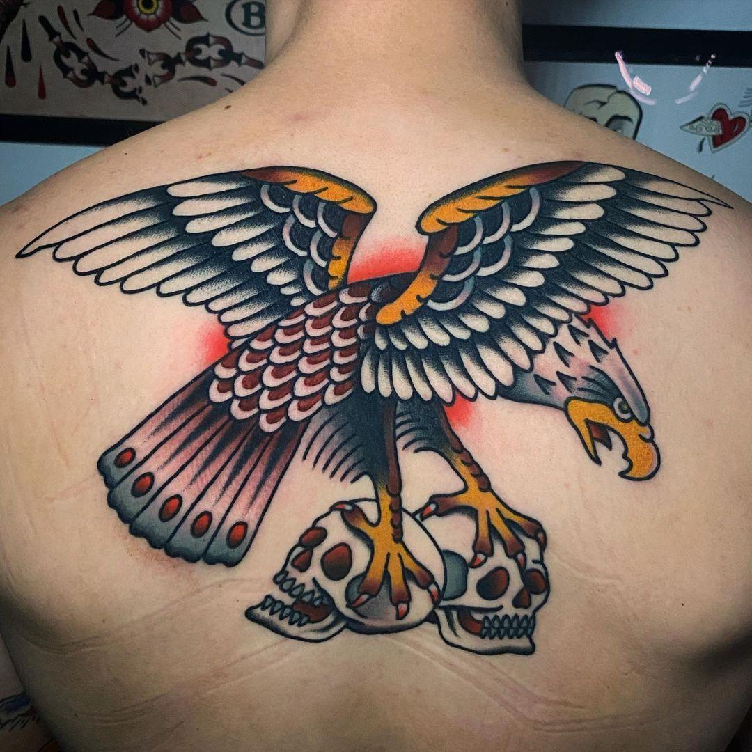 Colored Eagle Holding Skull Tattoo