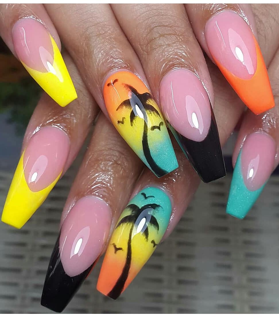 bright summer nails with palm tree on one and french tips on other nails