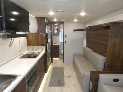 The galley kitchen and Murphy bed in this Winnebago Navion class C diesel motorhome