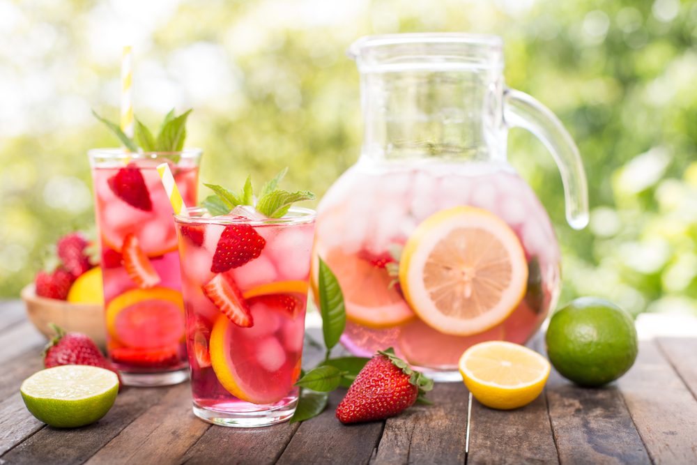 strawberry lemonade pitcher with glasses