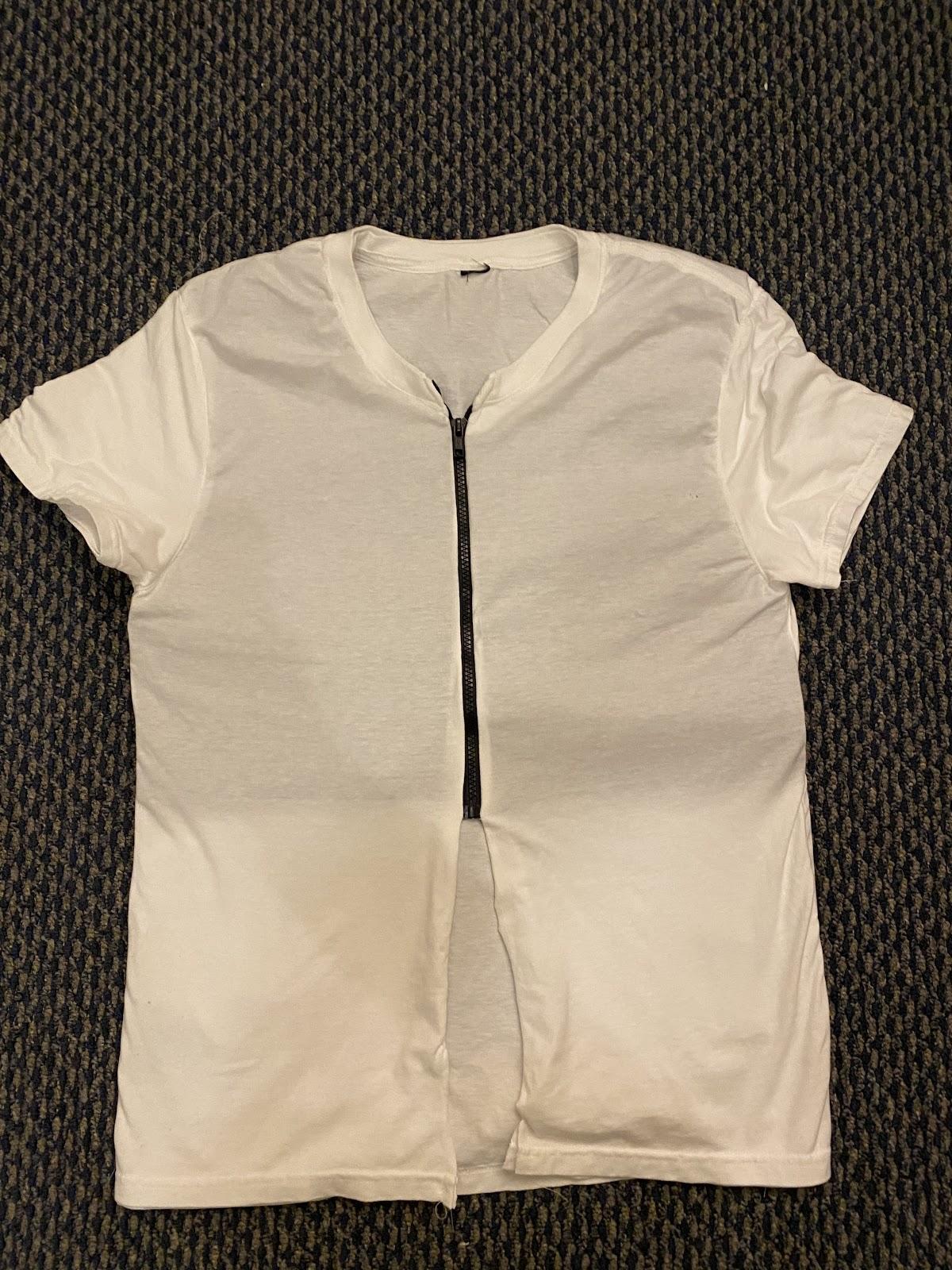 A white shirt on a grey surface

Description automatically generated with low confidence
