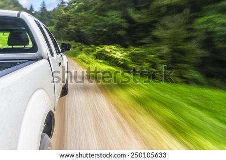A pick up truck driving off-road