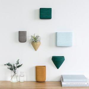 Ceramic hanging wall planters in a variety of shapes, sizes, and colors photo