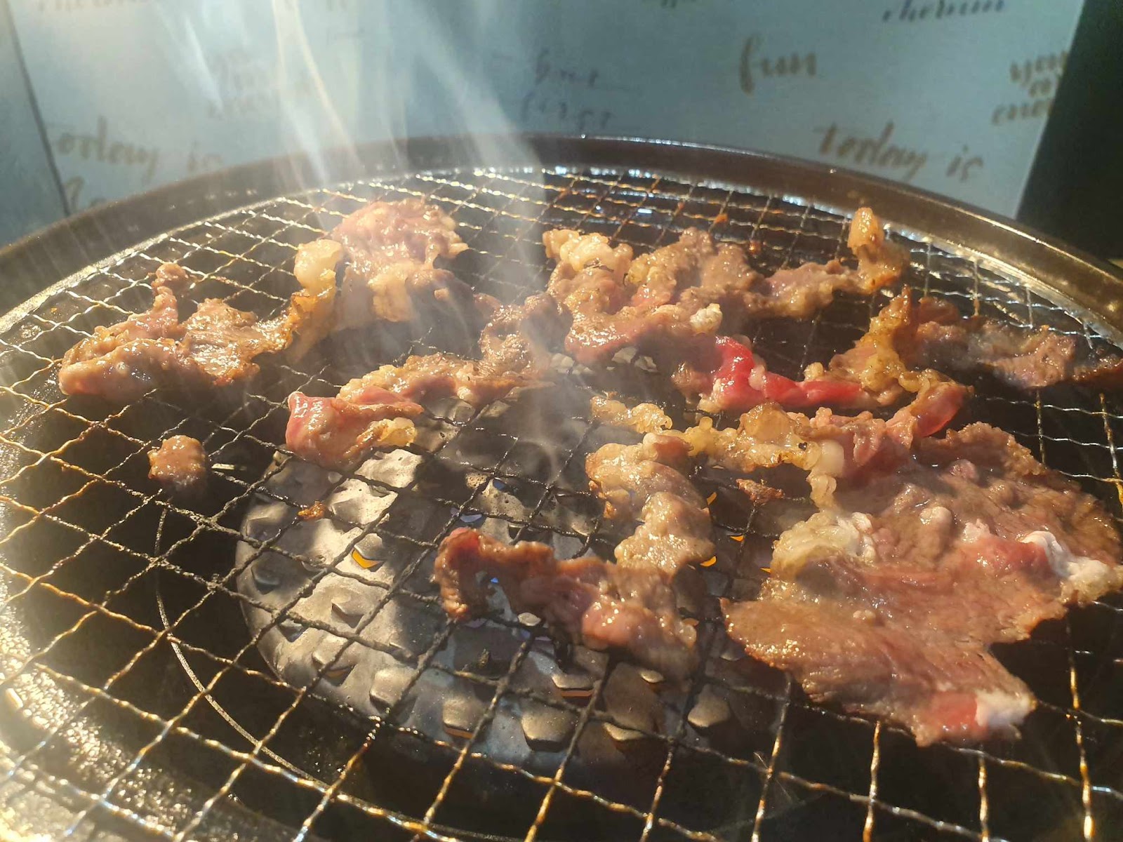 cooked beef on the grill at 焼肉力丸上本町店