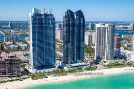 A large body of water with a city in the background

Description automatically generated