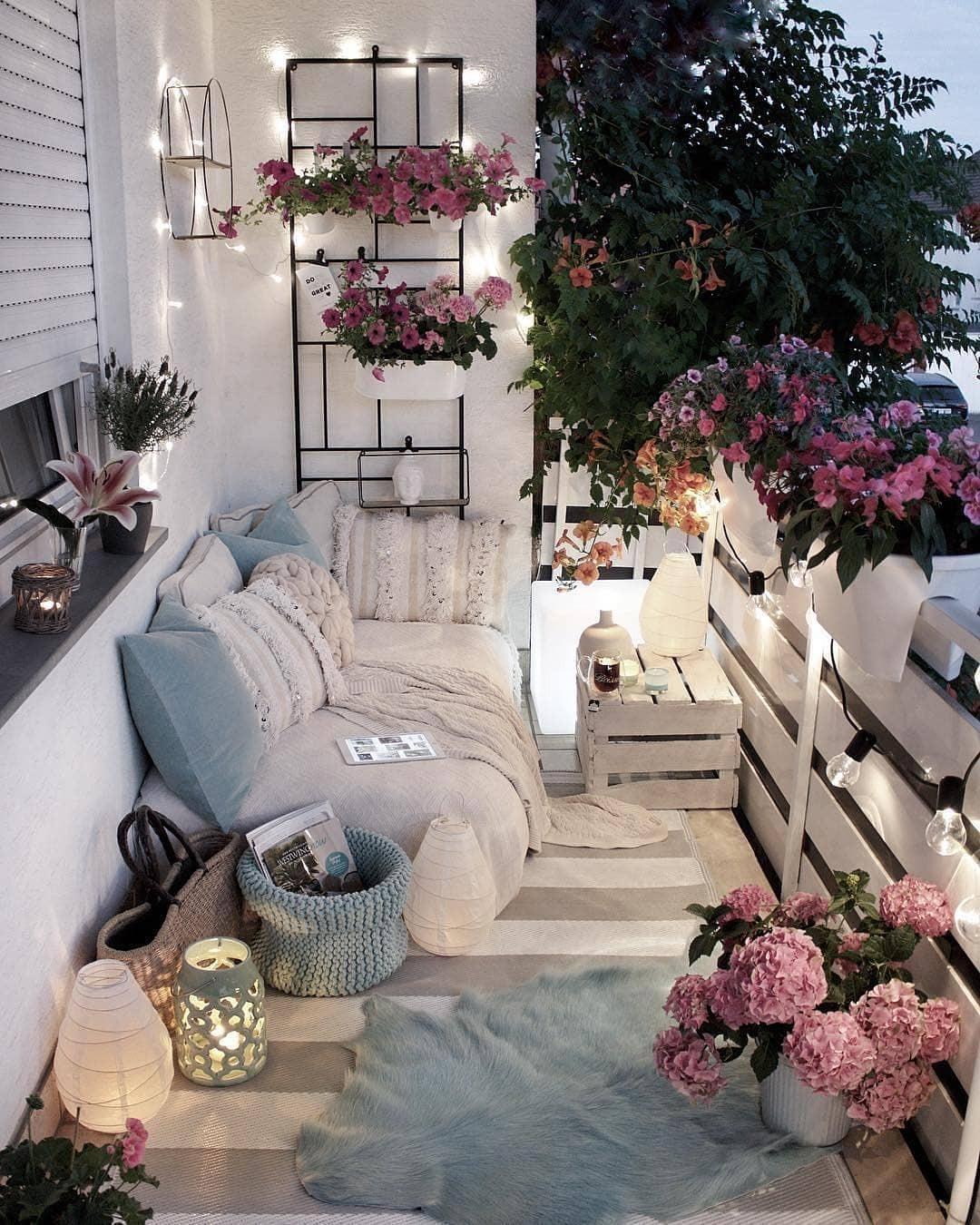 Small balcony made cozy using soft string lighting