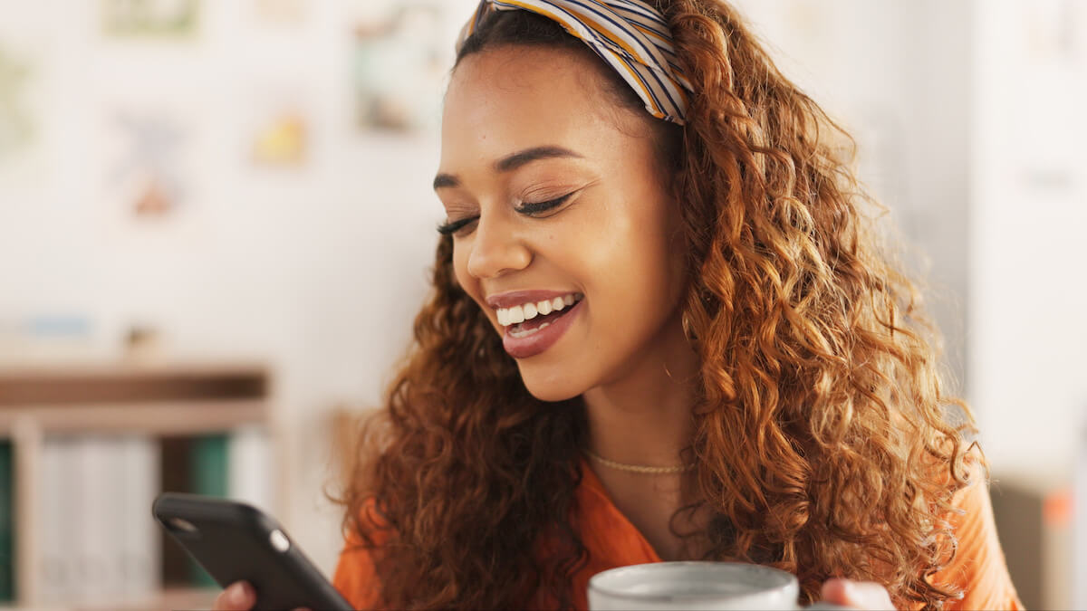 Woman happily using a phone