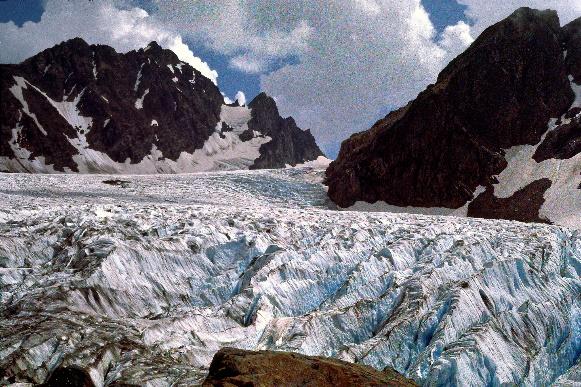 A glacier in the mountains Description automatically generated