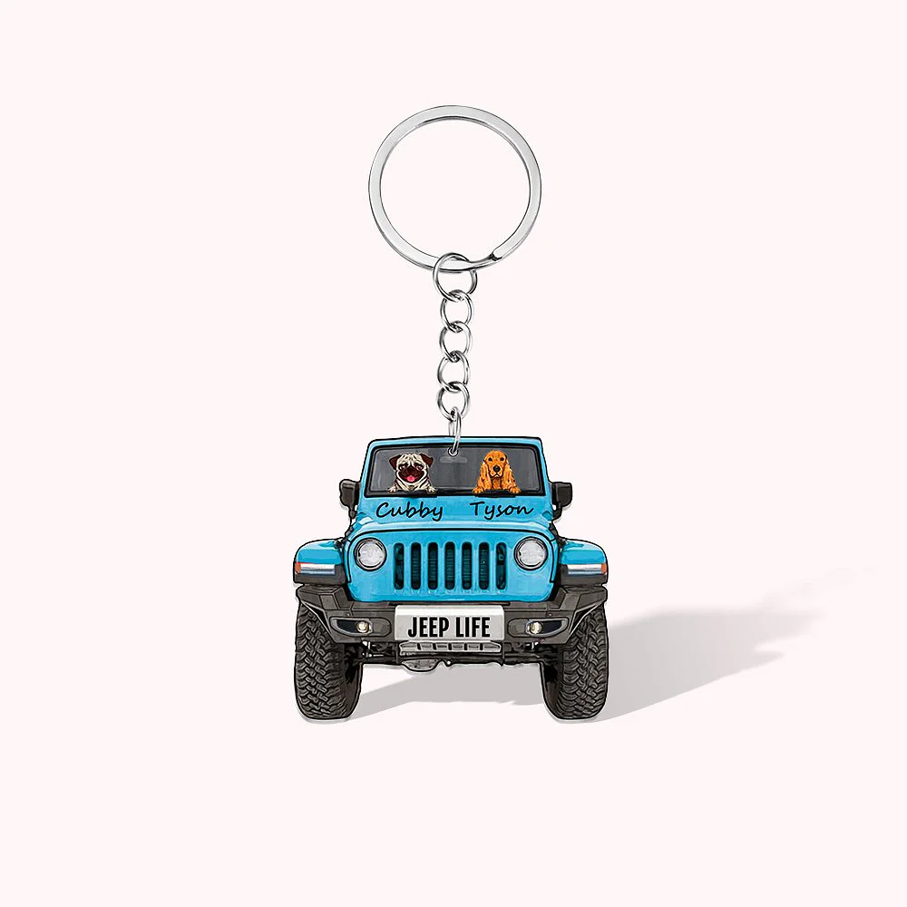 Porte-clefs en forme de Jeep de couleur bleue, conduite par deux chiens dont les noms sont inscrits sous le pare-brise.