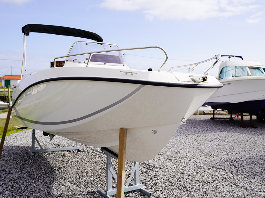 Two boats out of the water on dry land