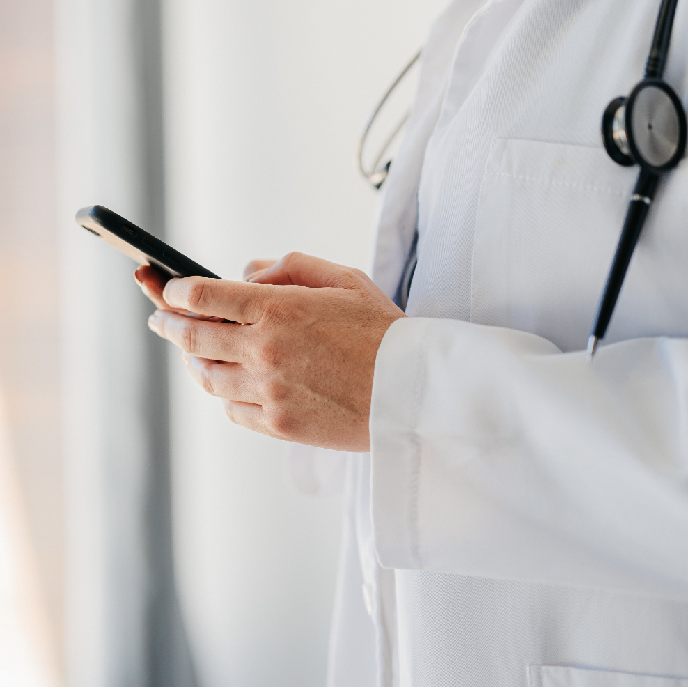 Pediatrician using mobile device