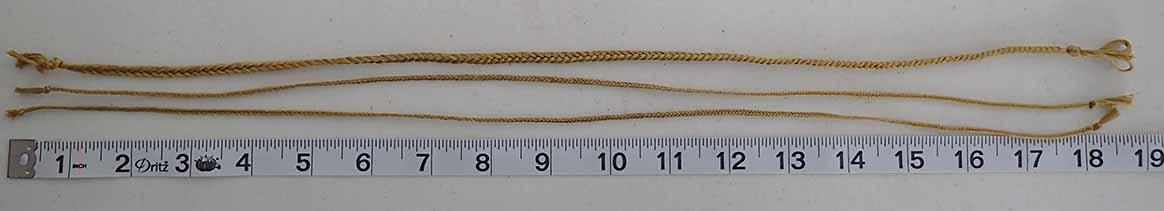 Three 19" pieces of golden yellow cord, one much heavier than the other two, for use as drawstrings and as belt-loop cord. All are knotted at both ends.