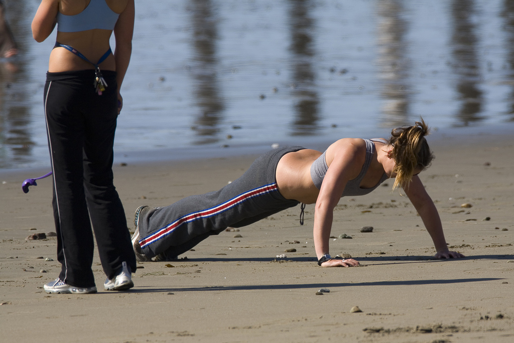Two girls exercising (one doing a push-up here) and walkin… | Flickr