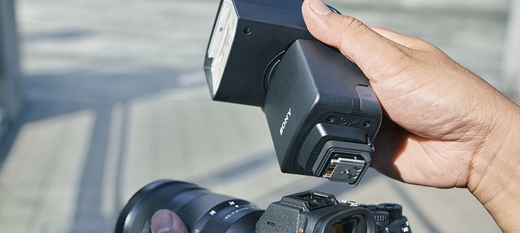 Image of metal shoe foot with rugged side frame under the flash