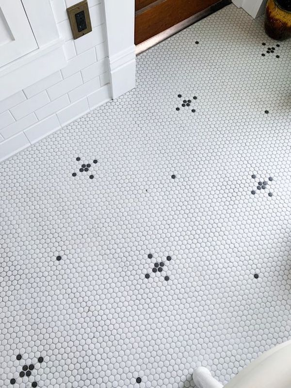 pretty black and white penny tile pattern on laundry room floor