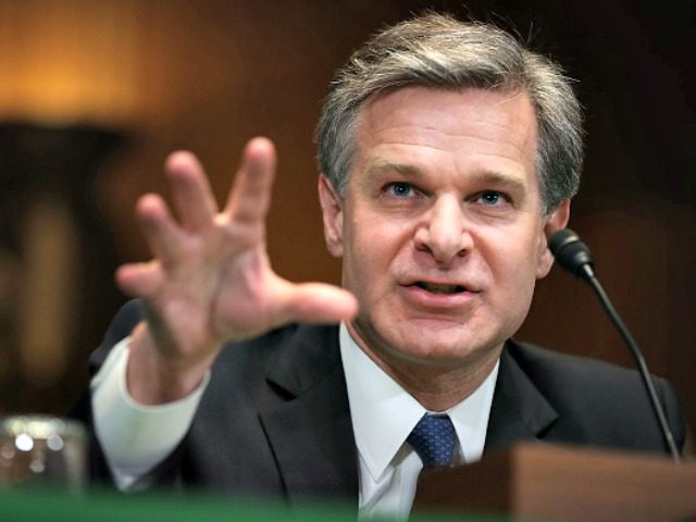 Christopher Wray Reaching