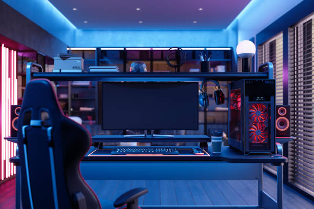 Gaming Room At Night With Neon Light. Gaming Chair, Speakers And Computer Monitor In The Room Gaming Room At Night With Neon Light. Gaming Chair, Speakers And Computer Monitor In The Room gaming stock pictures, royalty-free photos & images