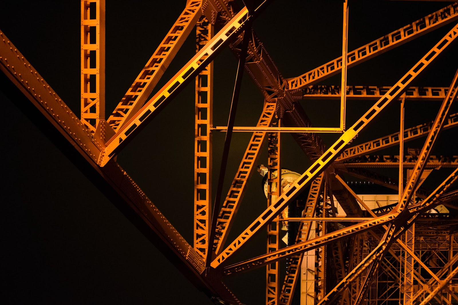 Image of a large metal structure with a black background