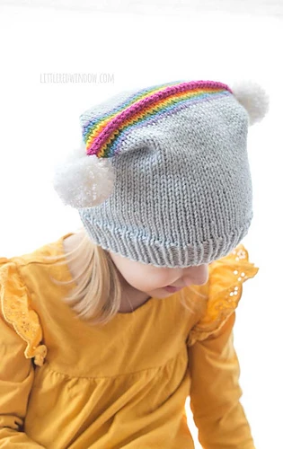 rainbow double pom hat on little girl