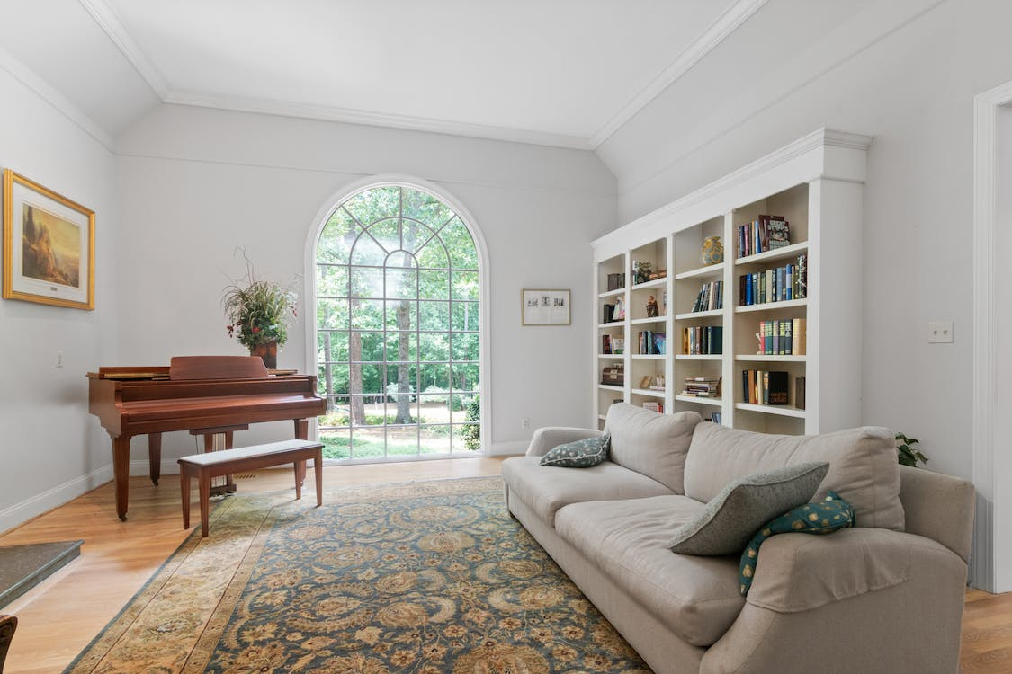 Gray Couch Near Brown Wooden Piano
